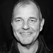 Smiling man in black and white